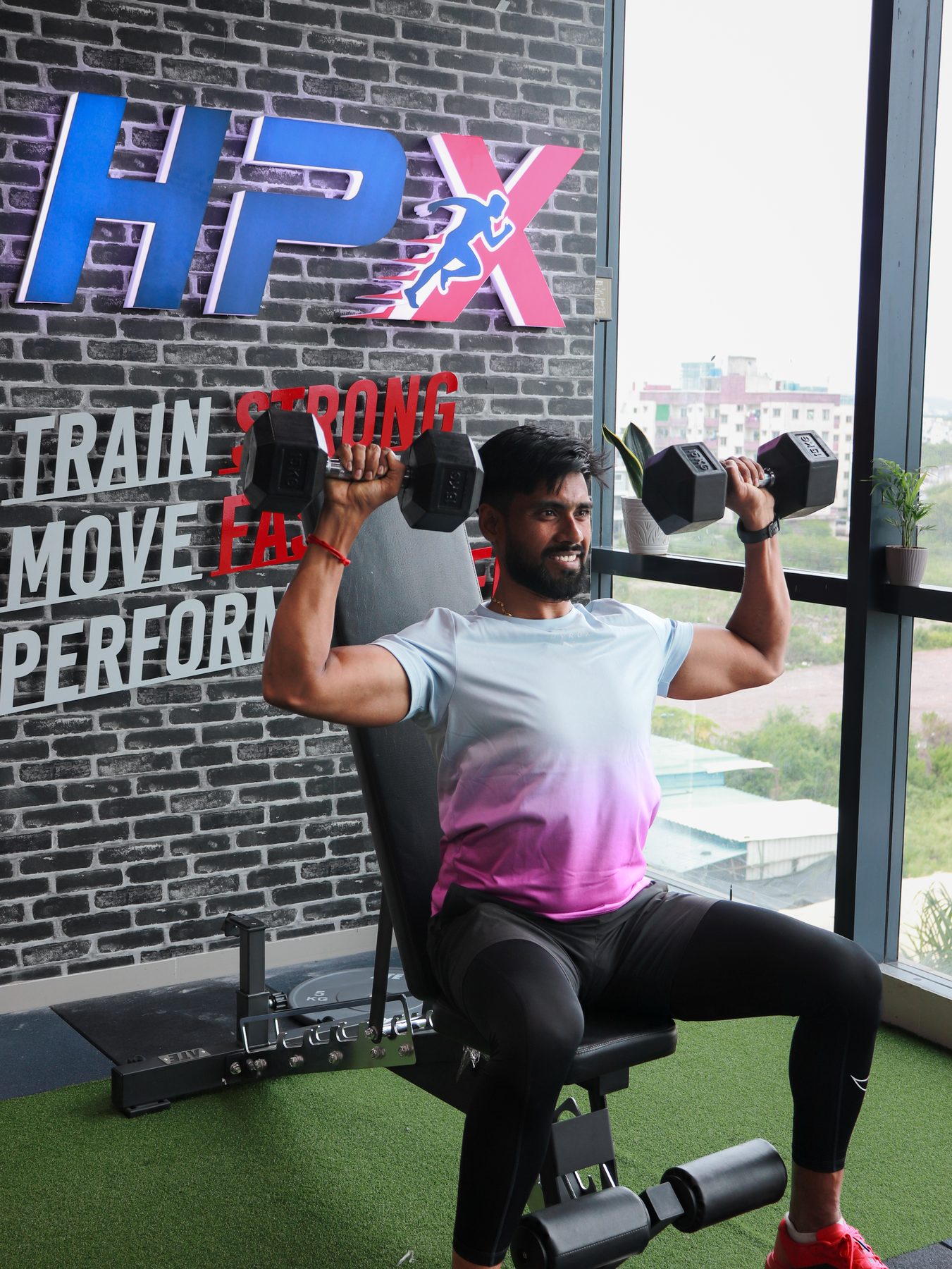 Shoulder press strength training at HPX